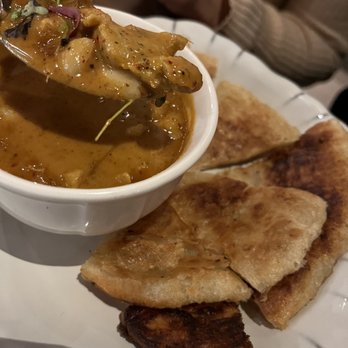 Mitr Thai - Pan-fried Roti, with peanut, chicken massaman curry dipping sauce. - Thai Near Me - New York, New York Mitr Thai - Pan-fried Roti, with peanut, chicken massaman curry dipping sauce. - Thai Near Me - New York, New York
