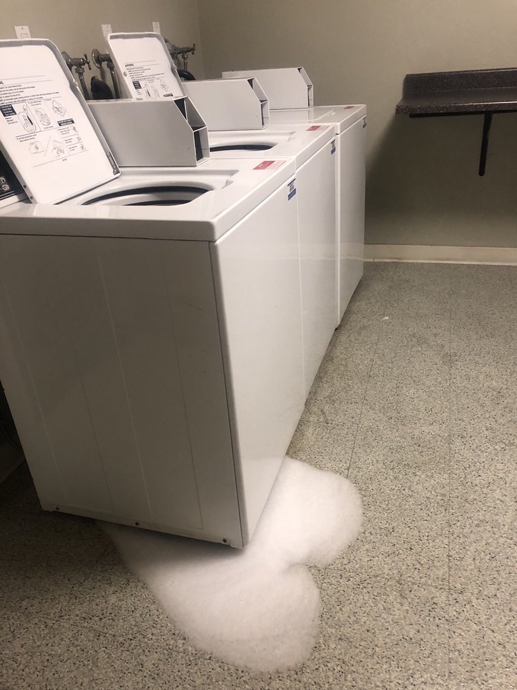 Laundry room washer leaking (this happens allot due to overuse) - Yelp