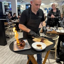 Steve, the owner of Mesa Moreira serving up the flaming Chouriço sausage! Delicious. Steve, the owner of Mesa Moreira serving up the flaming Chouriço sausage! Delicious.