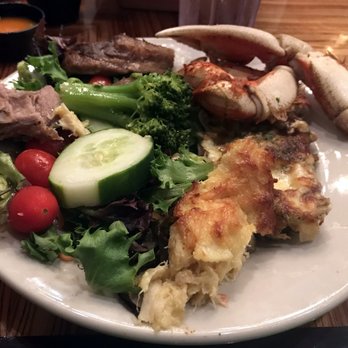 Captain George's Seafood Restaurant - I especially loved the baked crab imperial (forefront in photo, next to the salad). And look at that beautiful crab claw! - Seafood Near Me - Kill Devil Hills, North Carolina