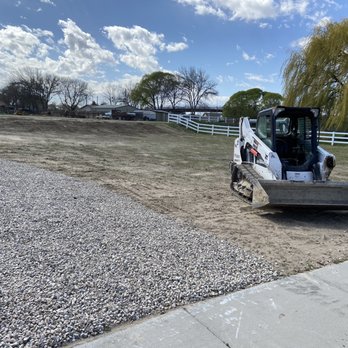 Back2Green - a small loader on a gravel road - Landscaping Near Me