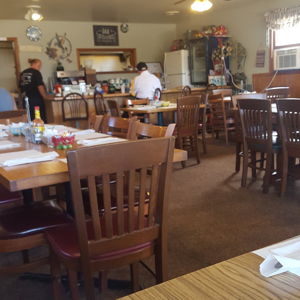 the dining room and kitchen of a country restaurant the dining room and kitchen of a country restaurant