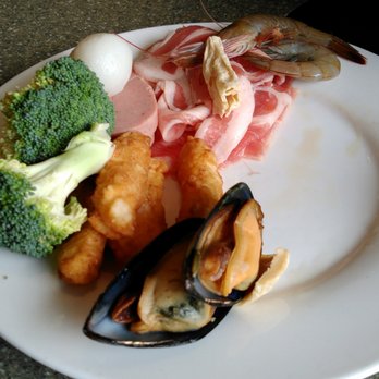 Happy Lamb Hot Pot - pork slices, some mussels, broccoli, shrimp and a cuttlefish ball - Mongolian Near Me - Toronto, Ontario
