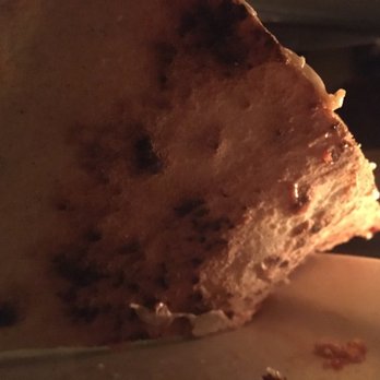 Lucali - The undercarriage of a plain slice - Pizza Near Me - Brooklyn, New York