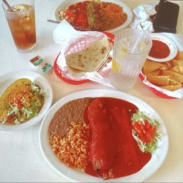 large combination plate beef taco chile relleno cheese enchilada with red chili.