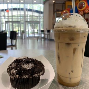 CrossRoads Coffee House - A double chocolate muffin with an iced latte - Coffee & Tea Near Me - Daytona Beach, Florida CrossRoads Coffee House - A double chocolate muffin with an iced latte - Coffee & Tea Near Me - Daytona Beach, Florida