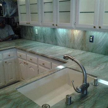 Mgc Granite - a kitchen counter with a sink and faucet - General Contractors Near Me - South Gate, California Mgc Granite - a kitchen counter with a sink and faucet - General Contractors Near Me - South Gate, California