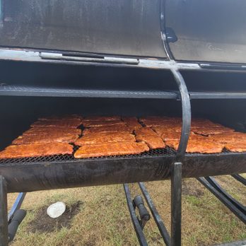 CG BBQ - a grill with a lot of food cooking on it - Food Trucks Near Me CG BBQ - a grill with a lot of food cooking on it - Food Trucks Near Me