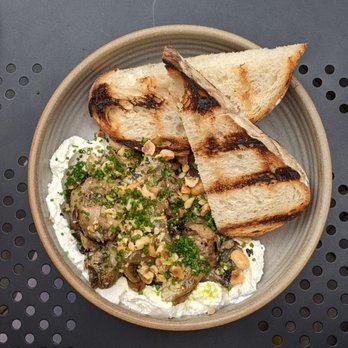 R40 - MARINATED ARTICHOKES Housemade ricotta, charred onions, hazelnuts - pretty tasty and huge portion as appetizer. Love the sourdough - Argentine Near Me - Long Island City, New York R40 - MARINATED ARTICHOKES Housemade ricotta, charred onions, hazelnuts - pretty tasty and huge portion as appetizer. Love the sourdough - Argentine Near Me - Long Island City, New York