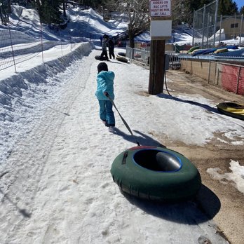 Ruidoso Winter Park - My daughter with her tube going back to the lift - Ski Resorts Near Me - Alto, New Mexico