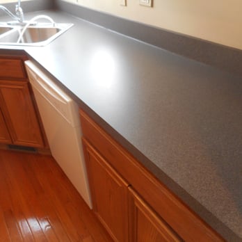The Surface Doctors - Green kitchen countertops after refinishing in one of our faux stone finishes. - Refinishing Services Near Me