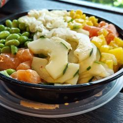 Shoyu Hibachi Express & Poke Bowl - Spicy tuna, spicy salmon, cucumber, edameme, mango, salad underneath,  corn