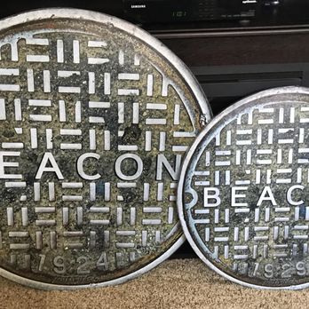 The Russell Cusick Gallery - Extra Large 32" Manhole cover next to a 24" standard size manhole cover. - Art Galleries Near Me - Beacon, New York The Russell Cusick Gallery - Extra Large 32" Manhole cover next to a 24" standard size manhole cover. - Art Galleries Near Me - Beacon, New York