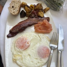 Thick cut Nueske's bacon with these incredibly good tasting orange eggs. Definitely a thumbs up. And yes, the potatoes were good too.