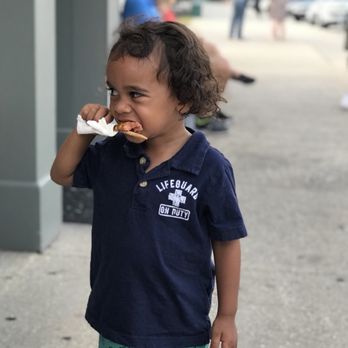 Pronto Pups - Jax enjoying a pup on a stick - Food Stands Near Me - Grand Haven, Michigan Pronto Pups - Jax enjoying a pup on a stick - Food Stands Near Me - Grand Haven, Michigan