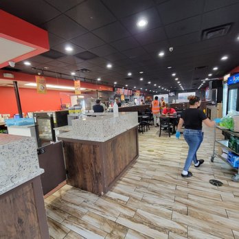 Kachi's Chicken - View from the front door. There is a dining room straight ahead in the back. There is another dining room straight ahead and to the right. - Peruvian Near Me - Suitland, Maryland
