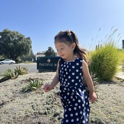 Calvary Chapel Pacific Hills - The church sign with a happy, little attendant
