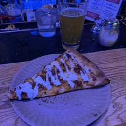 Buffalo Chicken pizza slice and a beer! Buffalo Chicken pizza slice and a beer!