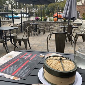 Rakkii Ramen - Outdoor seating in the back patio area - separated from the parking lot - Ramen Near Me - Smithtown, New York Rakkii Ramen - Outdoor seating in the back patio area - separated from the parking lot - Ramen Near Me - Smithtown, New York