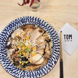 Table of Munchies - Black garlic, truffle oil, tonkotsu ramen noodle soup.
