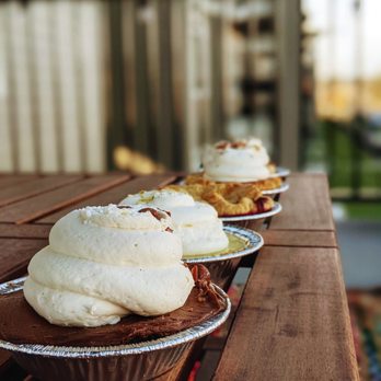 Birdie's Pie Shop - Chocolate in front, then key lime, triple berry, pumpkin, and peanut butter - Bakeries Near Me - Post Falls, Idaho