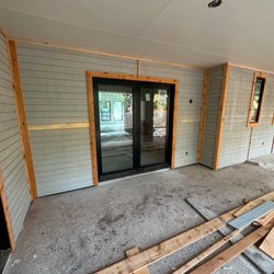 Retrocraft Door Repair - Installation of siding, trim, and exterior French doors