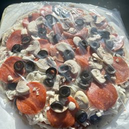 Small pizza with mushroom, pepperoni, and olives. Small pizza with mushroom, pepperoni, and olives.