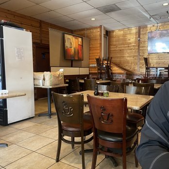 Mi La Cay - a man sitting at a table in a restaurant - Vietnamese Near Me - Seattle, Washington Mi La Cay - a man sitting at a table in a restaurant - Vietnamese Near Me - Seattle, Washington