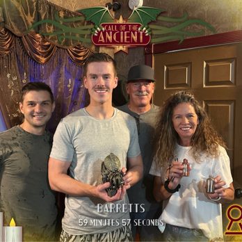 Escape Hour Austin - Inside the escape room. The four players and our time of completion. - Escape Games Near Me - Austin, Texas