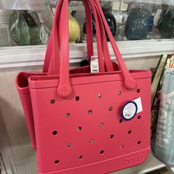 $49.99 for watermelon colored Bogg baby!!! Not bad at all - they're hanging in the front where the registers and reusable shopping bags are