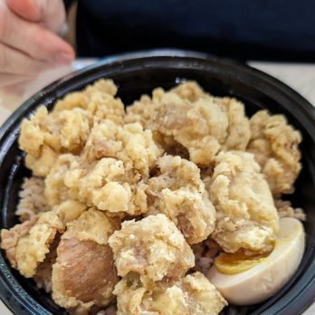 EkiBen House - a person holding a bowl of food - Japanese Near Me - Port Charlotte, Florida EkiBen House - a person holding a bowl of food - Japanese Near Me - Port Charlotte, Florida