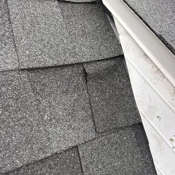All Exteriors Plus - Shingles too tight to wall flashing they are buckling causing a leak - General Contractors Near Me - Janesville, Wisconsin All Exteriors Plus - Shingles too tight to wall flashing they are buckling causing a leak - General Contractors Near Me - Janesville, Wisconsin