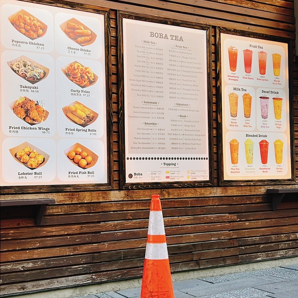a traffic cone in front of a restaurant