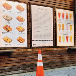 a traffic cone in front of a restaurant a traffic cone in front of a restaurant