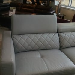 Rooms To Go - Alpharetta - Interesting modern design with adjustable headrest. Don't like it.