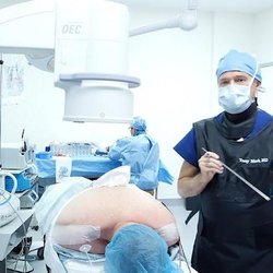 Tony Mork, MD | Endoscopic Spine Surgeon - Picture of Dr. Mork performing an endoscopic spine surgery at his endoscopic spine clinic.