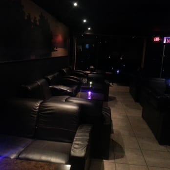 Shaherzad Hookah - a row of recliners in a dimly lit room - Hookah Bars Near Me - Edison, New Jersey