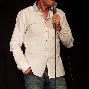 J.R.'s Comedy Club - a man holding a microphone - Comedy Clubs Near Me - Valencia, California J.R.'s Comedy Club - a man holding a microphone - Comedy Clubs Near Me - Valencia, California