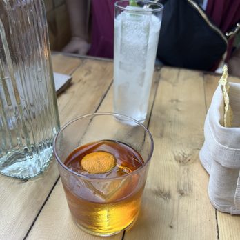 Chupito - Bonampak (Foreground, Milk clarified rum w/ coffee and orange) + Puertecito (Background, Blanco w/ watermelon 2 ways) - Cocktail Bars Near Me - Vancouver, British Columbia