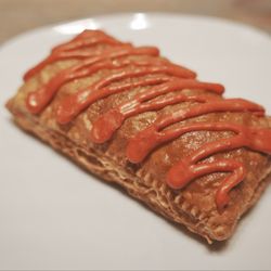 Raspberry Pop Tart. Buttery shortcrust with a pleasant snap at the edges, cradling a tangy raspberry jam with a berry-forward taste.