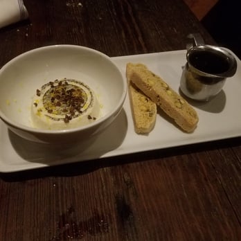 Coltivare - Meyer lemon panna cotta with pistachio biscotti and espresso syrup... so good. - Italian Near Me - Houston, Texas Coltivare - Meyer lemon panna cotta with pistachio biscotti and espresso syrup... so good. - Italian Near Me - Houston, Texas