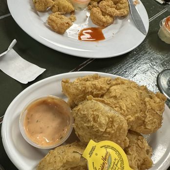 Crazy 'Bout Crawfish - This was the onion petals super good!!! and in the back was the fried sampler with shrimp, alligator oysters, and crawfish!!!  awesome - Cajun/Creole Near Me - Breaux Bridge, Louisiana