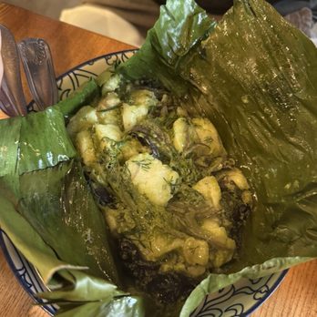 Thip Khao - Moak - A traditional Laotian dish served in a bowl with banana leaves, featuring a mixture of vegetables, herbs, and possibly fish or meat, typical of Lao cuisine. - Laotian Near Me - Washington, DC, District of Columbia