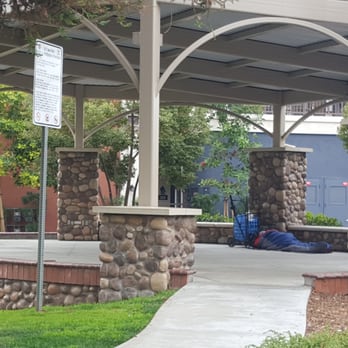 Heritage Plaza Park - A guy sleeping on the stage in a sleeping bag (homeless?) - Parks Near Me - Covina, California