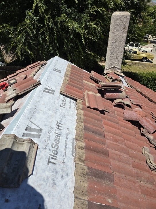 Slide of Richy’s Roofing Repair