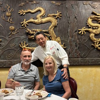 Chef Chu's - Chef Chu himself in front of the large 9-dragon panel. - Chinese Near Me - Los Altos, California