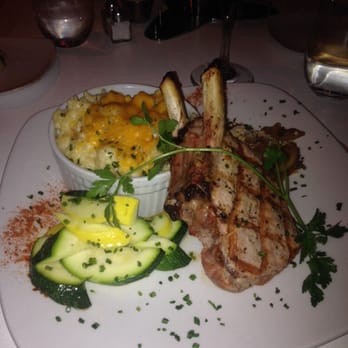 Strip Steakhouse - Massive double bone in pork chop! Mac and cheese, squash and apples that are hidden behind this monster piece if meat! - Steakhouses Near Me - Avon, Ohio Strip Steakhouse - Massive double bone in pork chop! Mac and cheese, squash and apples that are hidden behind this monster piece if meat! - Steakhouses Near Me - Avon, Ohio