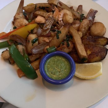 Lauriol Plaza - Marisco saltado. Little to no salmon, soggy fries and not too tasty. - Mexican Near Me - Washington, DC, District of Columbia