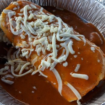 Taco Mesa - I ate my burrito so fast I forgot to get a pic but here's my friends Al Pastor wet burrito. I had a taste and it was bomb! - Mexican Near Me - Costa Mesa, California