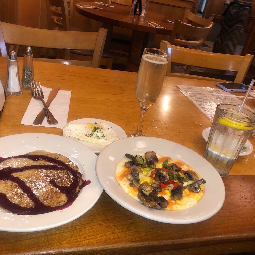 Moosewood Restaurant - Mushroom and Grits, Fried Egg, Pancake with Blueberry Honey Syrup, and a Lavender Mimosas. Lemon water - New American Near Me - Ithaca, New York Moosewood Restaurant - Mushroom and Grits, Fried Egg, Pancake with Blueberry Honey Syrup, and a Lavender Mimosas. Lemon water - New American Near Me - Ithaca, New York
